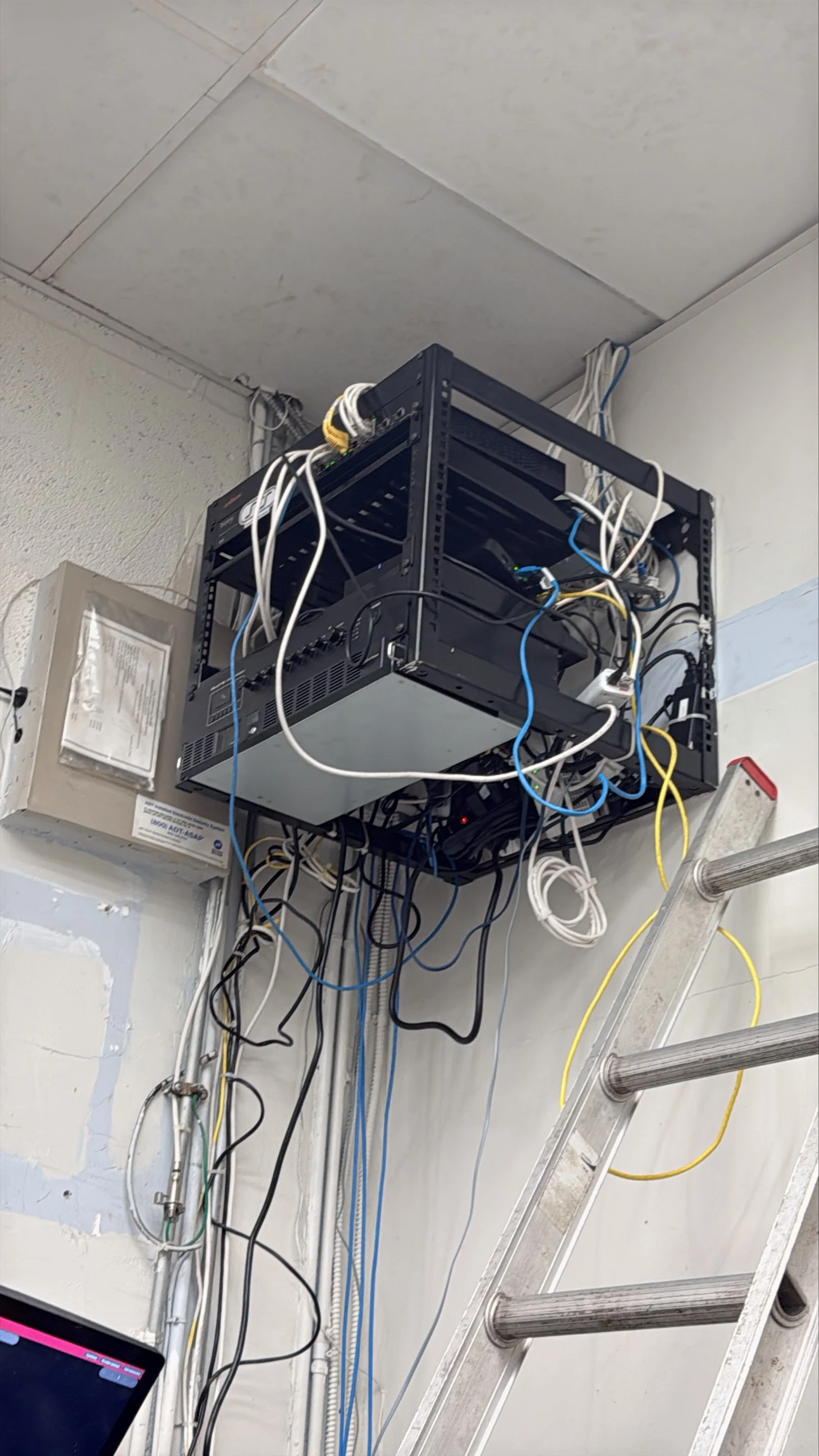 Existing kitchen rack at Florentin Bakery Hollywood before network remediation, with loose cabling